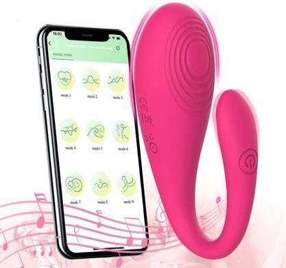 Рожевий U-подібний смарт-вібратор поруч зі смартфоном із відкритим Bluetooth-додатком